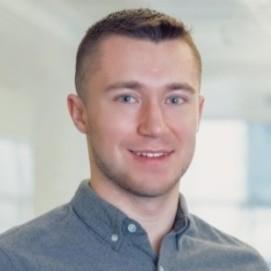 Justin Sheil, Content Marketing Manager at Electric wearing a blue button down shirt