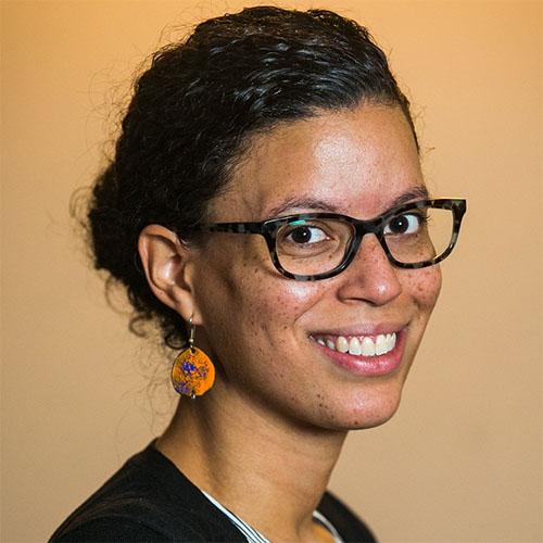 Melody Lopez, co-executive director of New York Civic Engagement Table, in glasses and a black jacket.