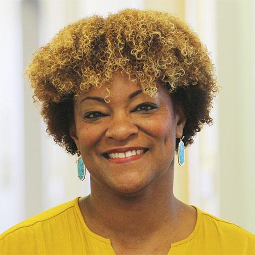 Headshot of Elisha Smith Arrillaga, Vice President, Research, Center for Effective Philanthropy, in a yellow top.