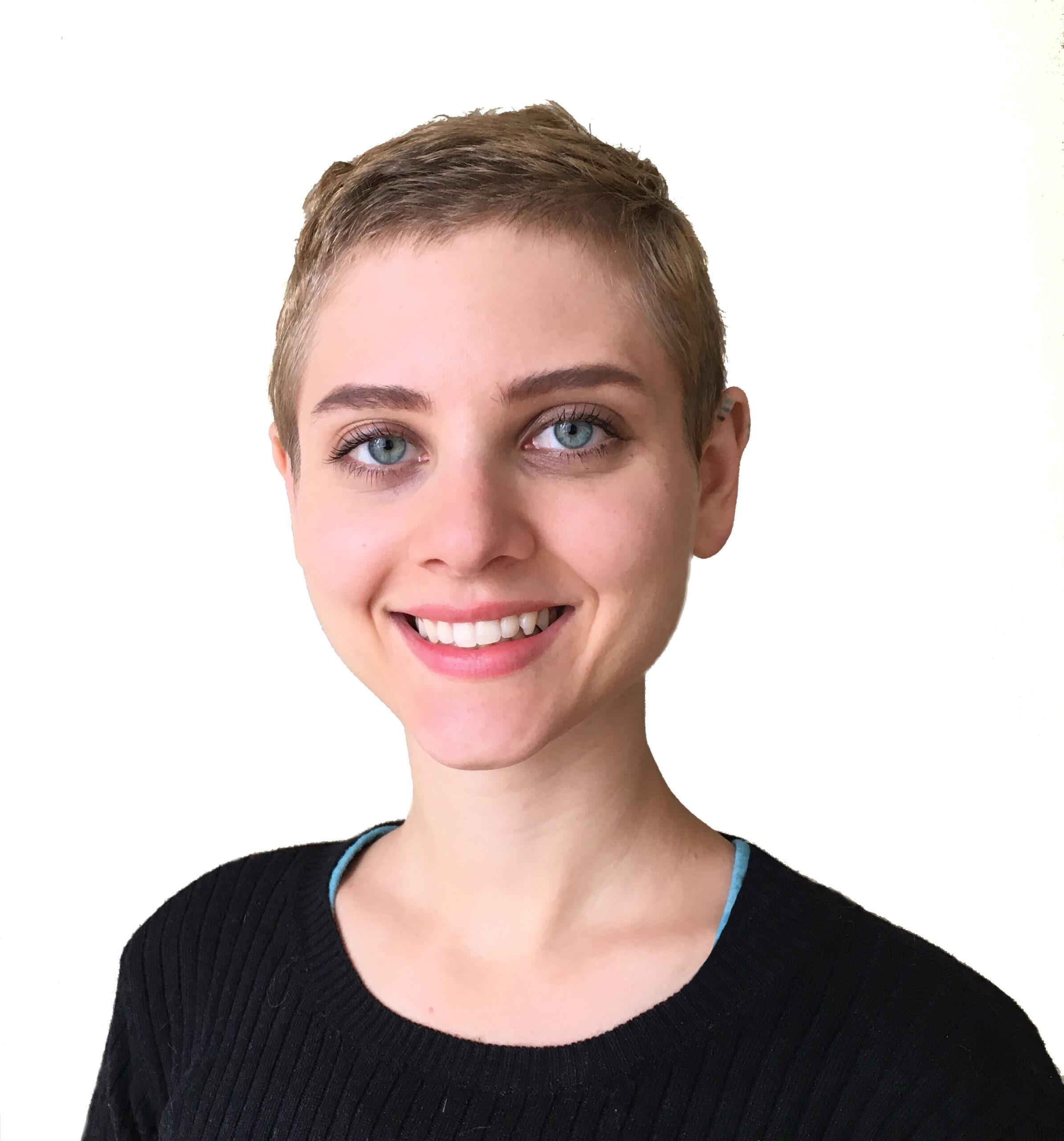 Katy Klein, Senior Customer Support Liaison, Candid, in a black top.