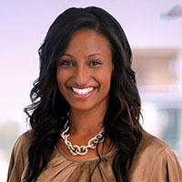 Headshot of Naomi Senbet, Manager, Boston, Washington DC Hub, The Bridgespan Group, in a dark beige top.