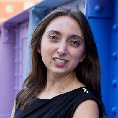 Headshot of Sarah Angello, head of strategic operations, Resilia, in a black dress.