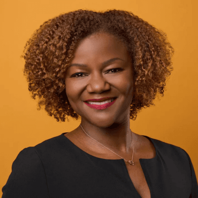 Headshot of Diane Headley Samuels, vice president and chief people officer at the Ford Foundation, in a black top.