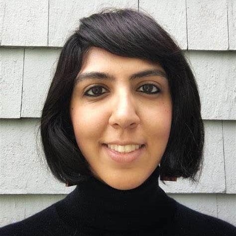 Headshot of Simar Singh, chief program officer at RefugePoint, in a black turtleneck.