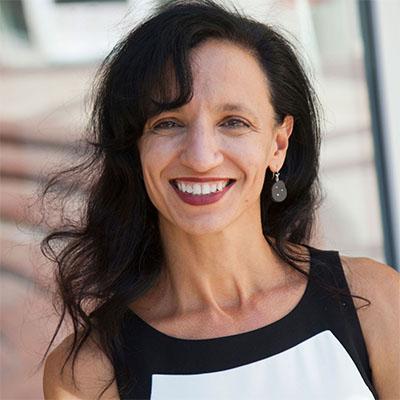 Headshot of Zannie Giraud Voss, director of SMU DataArts, in a black and white top.