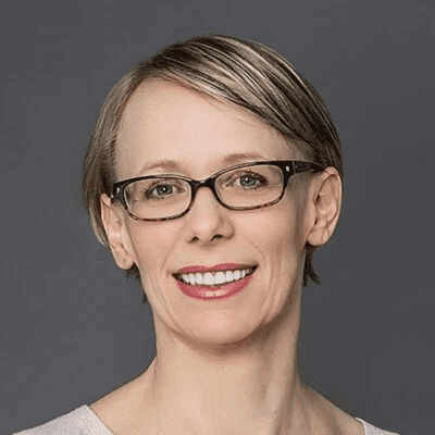 Headshot of Kimberly Spring, director of research and evaluation at the Annie E. Casey Foundation, in a white top and glasses.