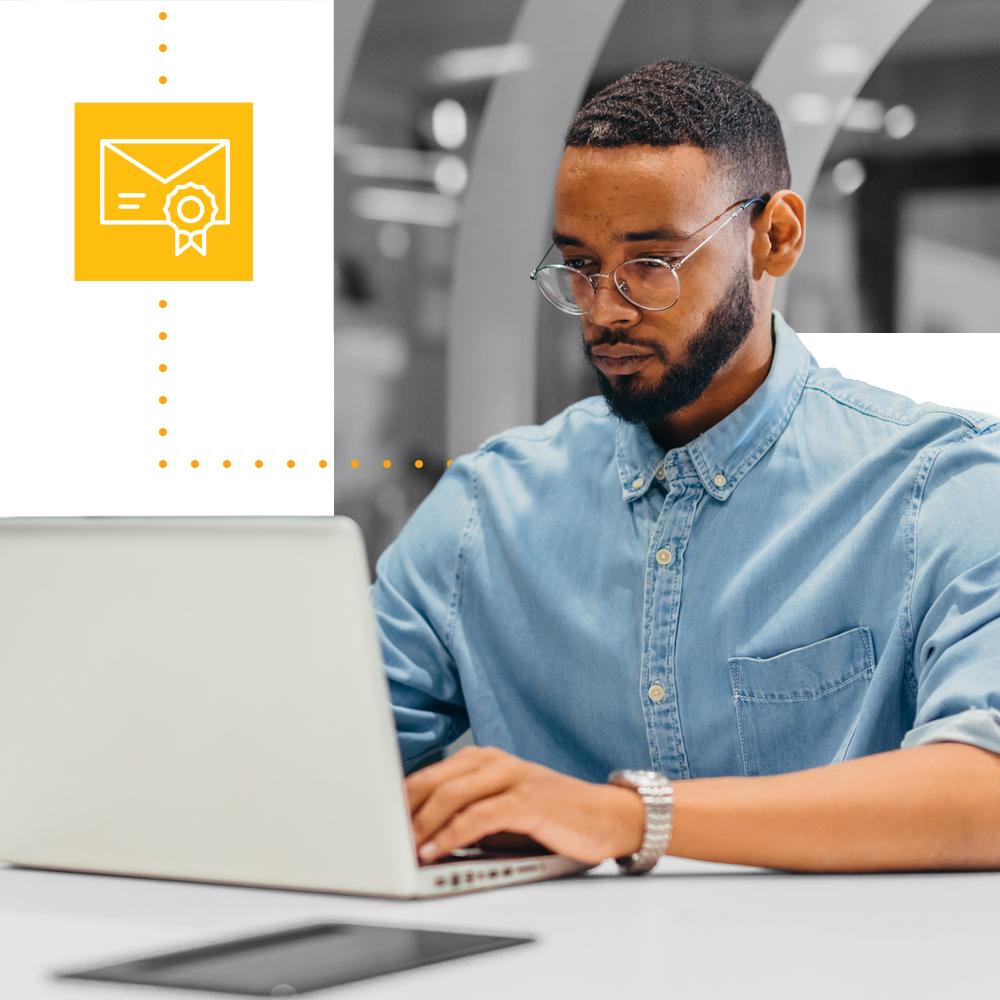 man with glasses sharing grants data on his laptop