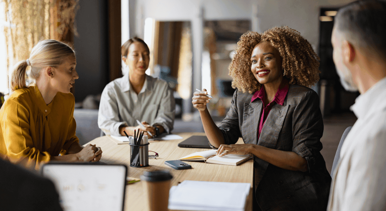 A small team discussing ways to engage donors.