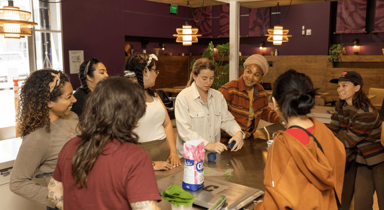 Members of La Cocina discussing long-term grants.