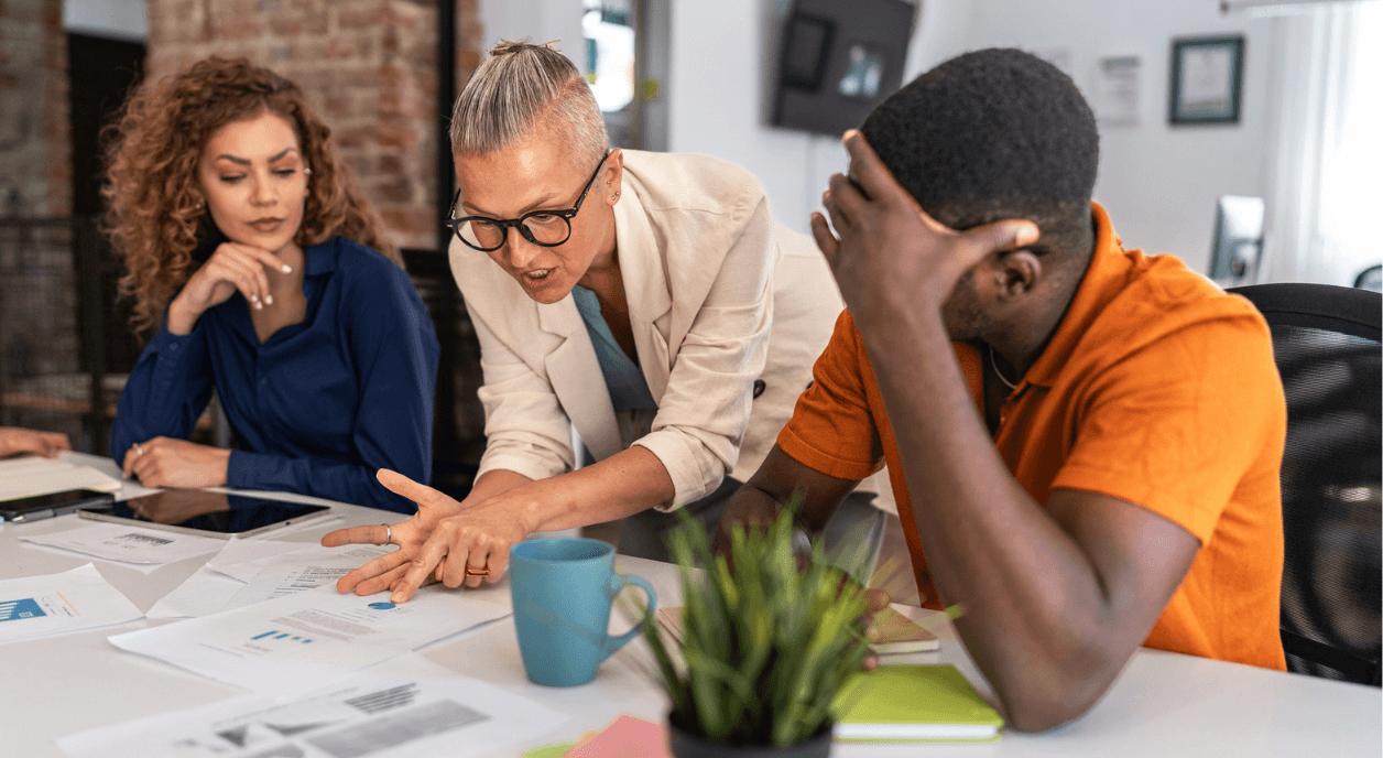 A nonprofit team discussing how to overcome the overhead myth.