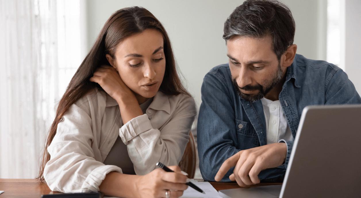A couple figuring out their charitable tax deduction.