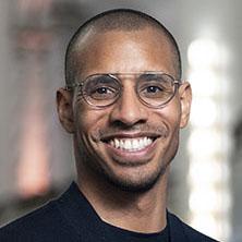 Devin Murphy, partner in The Bridgespan Group's New York office, in a navy blue sweater.