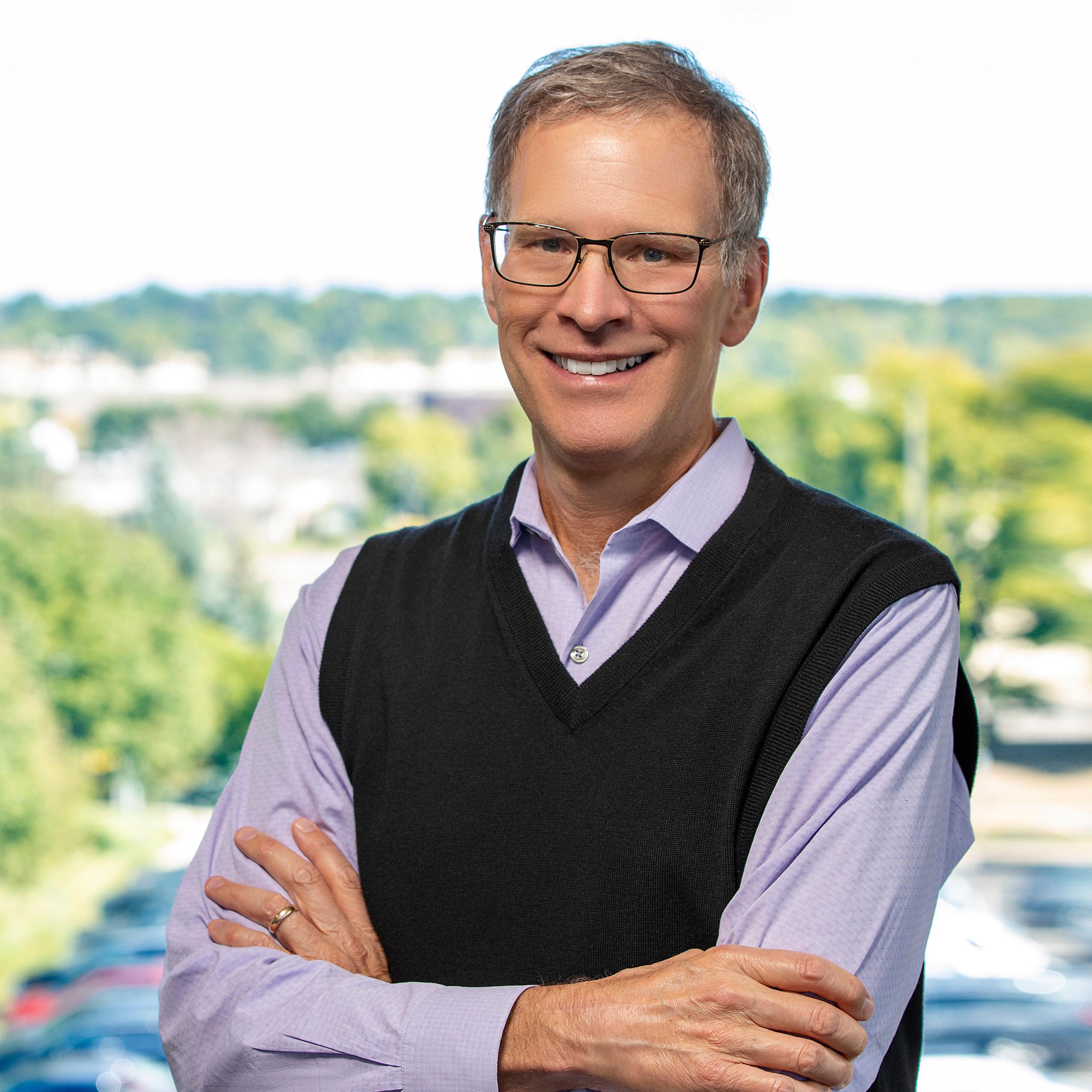 Headshot of Kevin Walker, president and CEO of the Northwest Area Foundation, in a blue jacket.