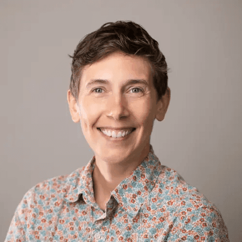 Headshot of Amy Sample Ward, CEO of NTEN, in a multi-colored shirt.