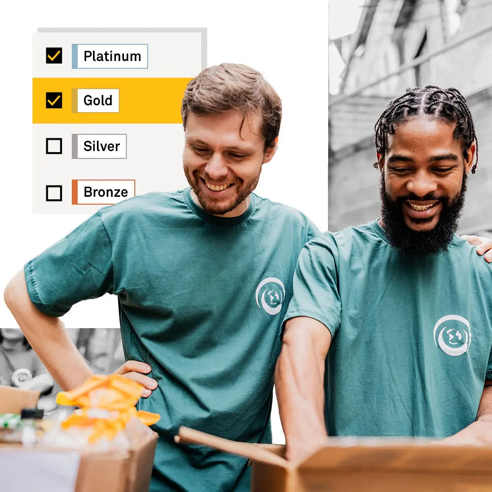 Two people volunteering at a nonprofit that received a Platinum Seal of Transparency.