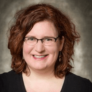 Headshot of Ruth K. Hansen, an associate professor at University of Wisconsin-Whitewater’s College of Business and Economics, and director of the Institute for Nonprofit Management Studies, in glasses and a black top.
