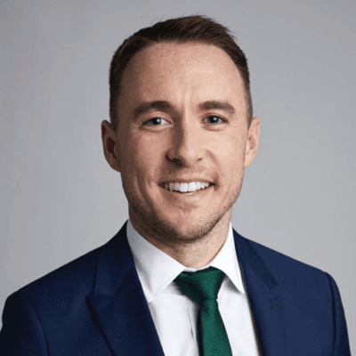 Headshot of Matthew Collins-Gibson, vice president of philanthropy, foundations, and board engagement at the International Rescue Committee.