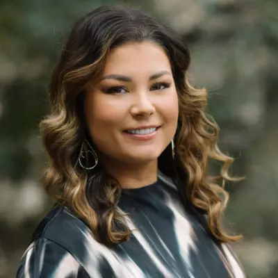 Headshot of Miichelle Flores Vryn, director of philanthropy, Mind & Life Institute, and co-Lead, Social Impact Staff Retention.