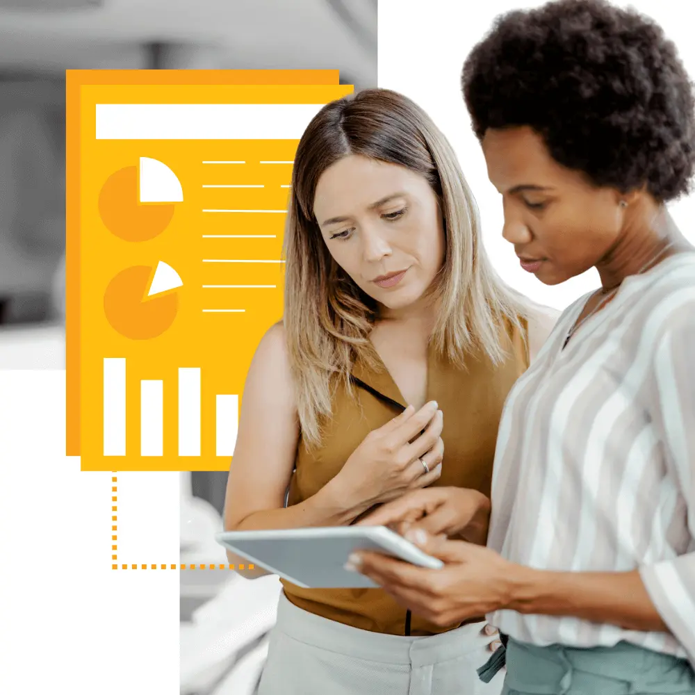 Two colleagues looking at research and data on nonprofit funding.