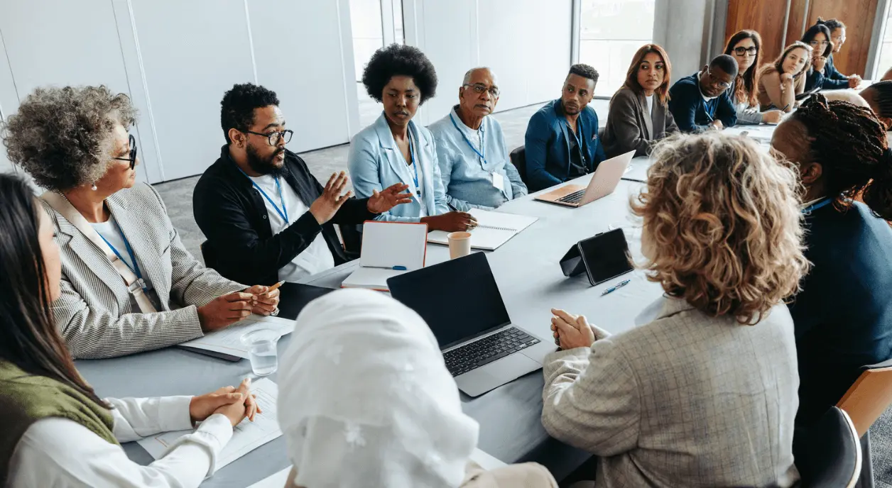 Funders and nonprofits collaborating together.