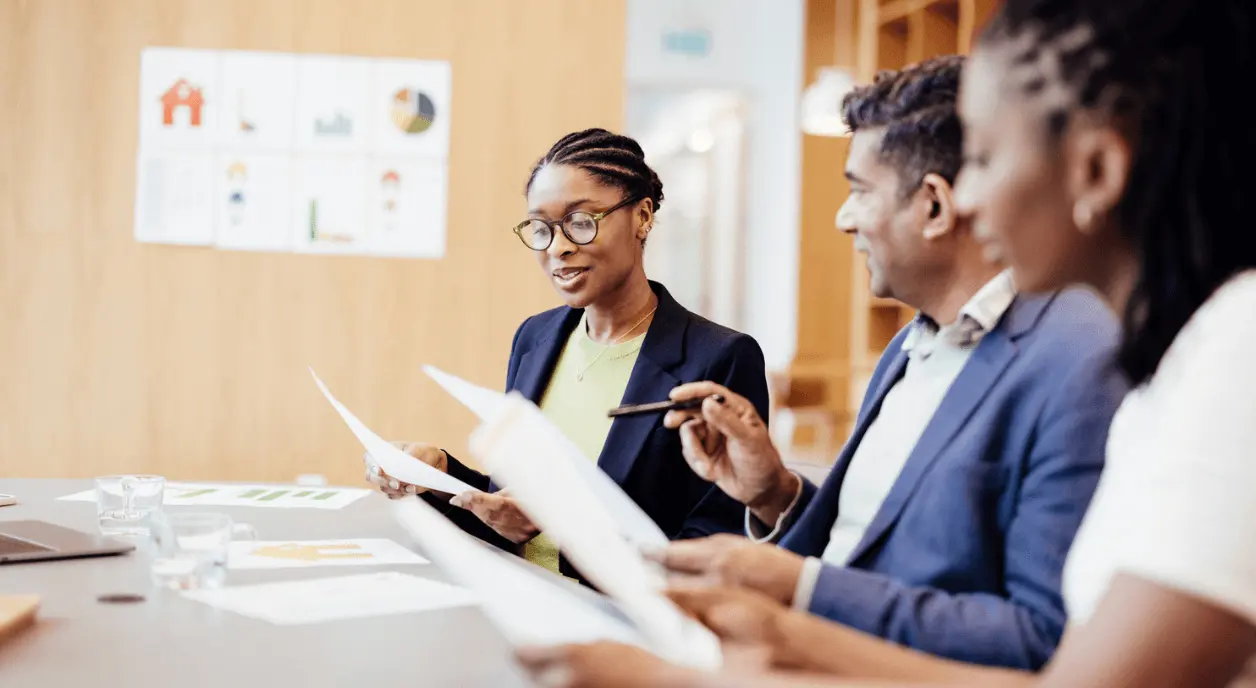 Foundation leaders analyzing grants data.