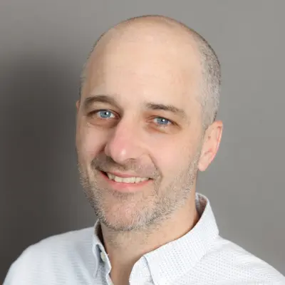 Headshot of Austin Snowbarger, director of strategy and research at the Center for Disaster Philanthropy.