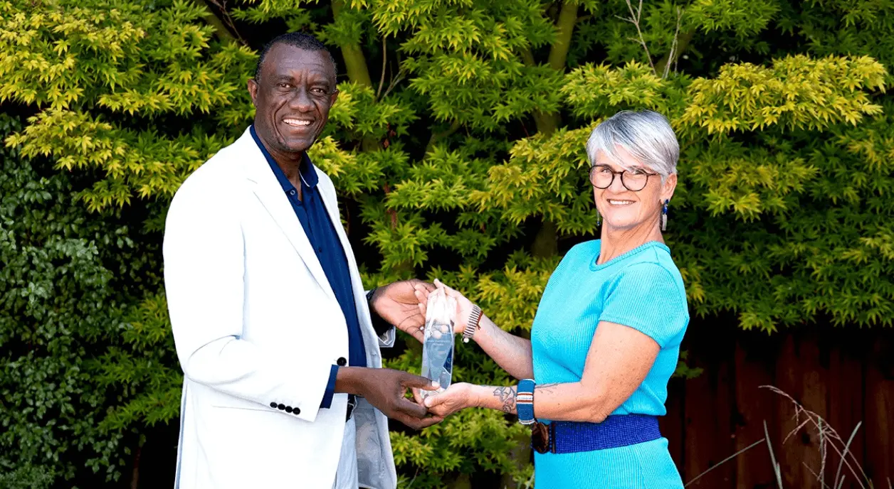 Lever for Change open call winner receiving an award.