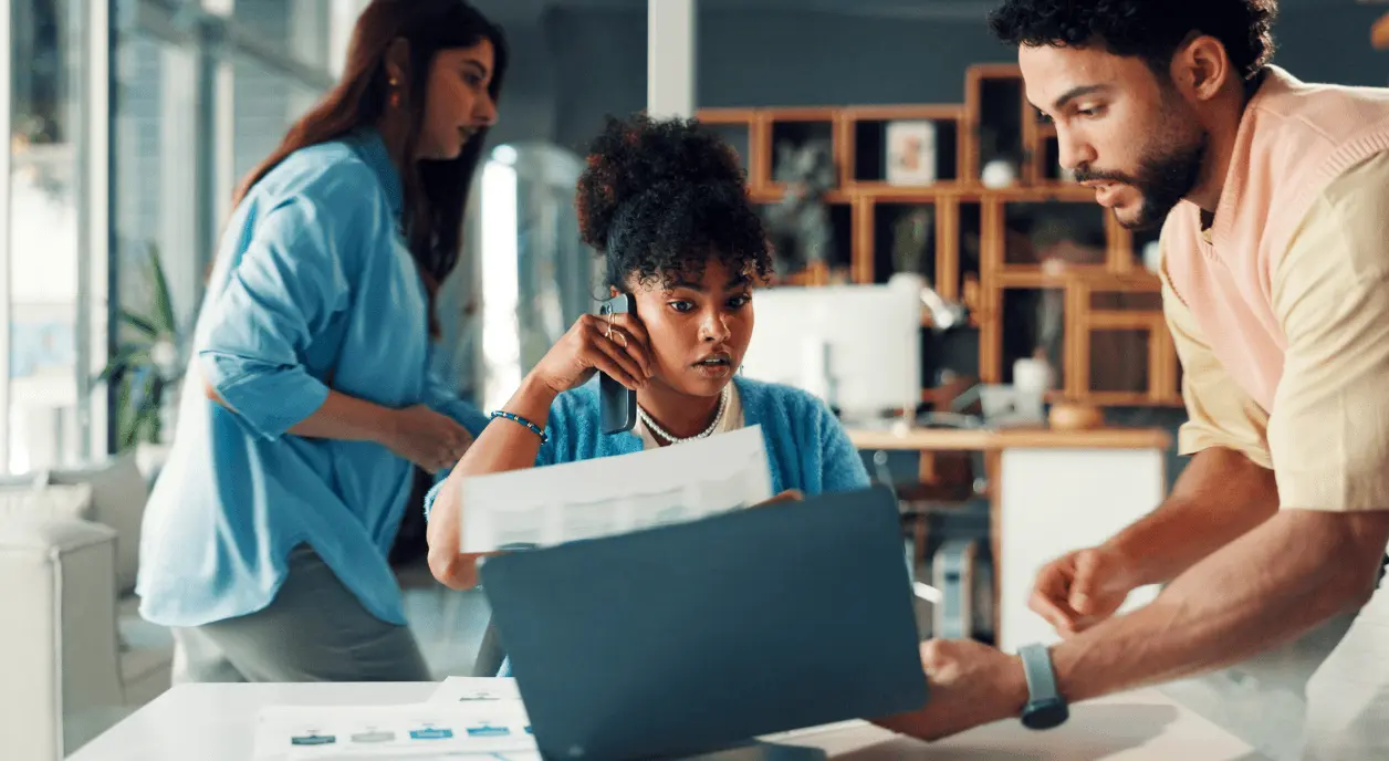 A nonprofit employee dealing with multiple tasks at once.