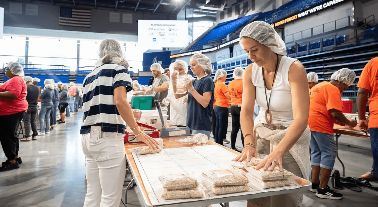 Volunteers in an assembly line.