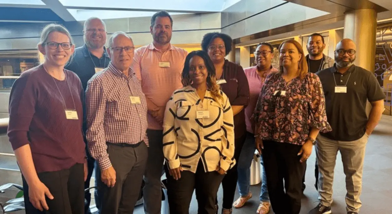 Group photo of staff from The Acuity Lab and a client nonprofit.