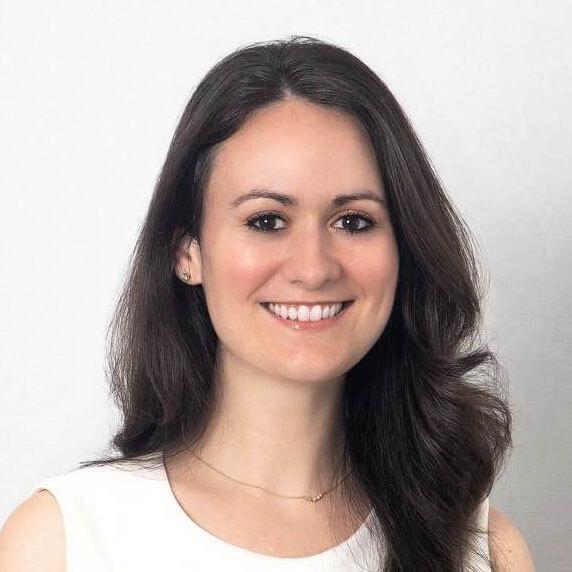 Headshot of Natalie Fellows, Senior Manager of Impact for Maverick Collective by PSI, in a white dress.