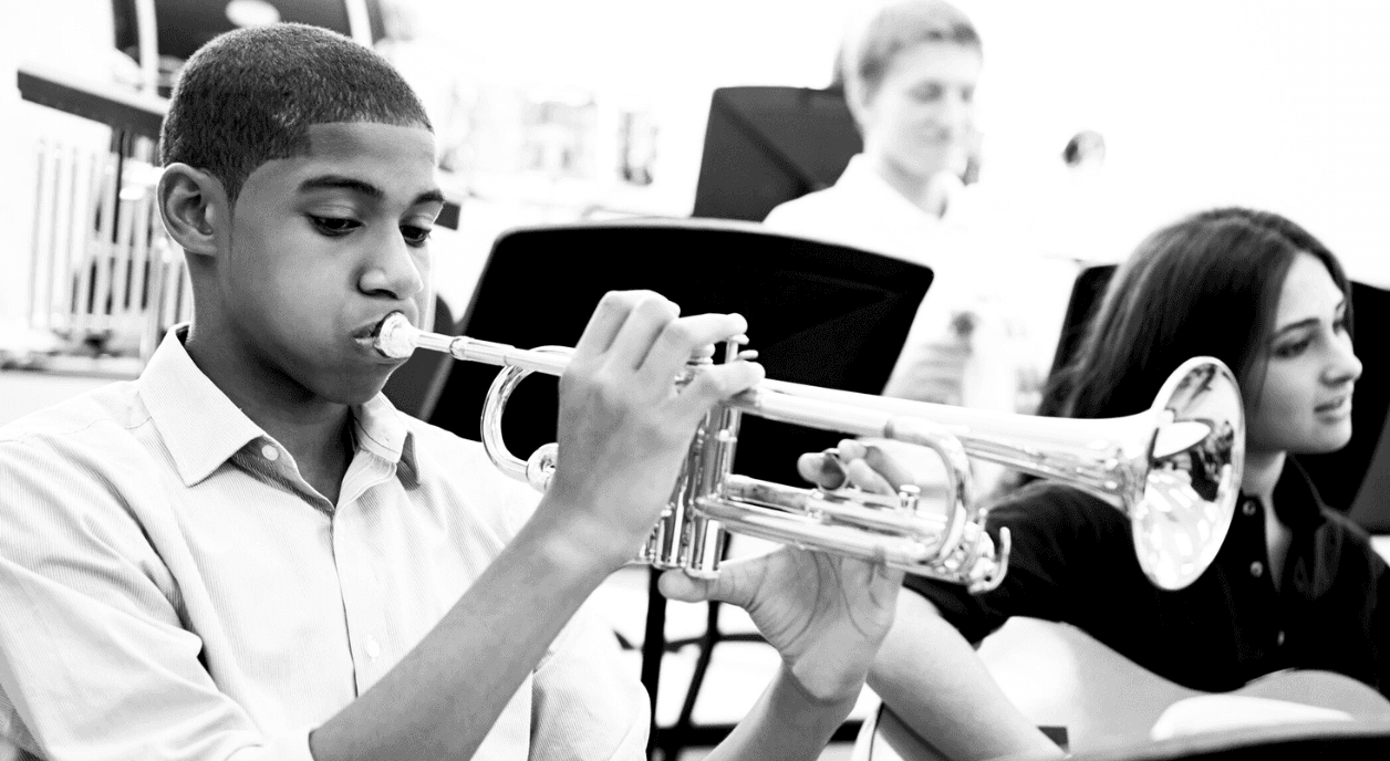 A musician plays a trumpet.